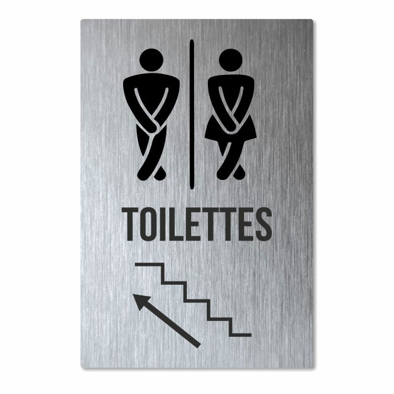 Panneau toilettes en haut de l'escalier
